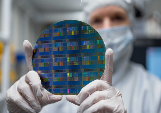 A project improving bottlenecks in the development of full-scale quantum computing has been awarded $3 million. Pictured is a large wafer scale quantum device developed by UNSW and Diraq. Photo: supplied