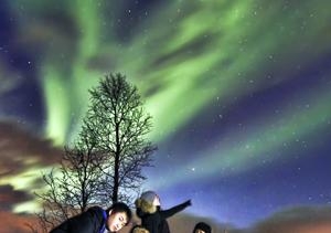 Ding Pang and friends witness the majestic northern lights.