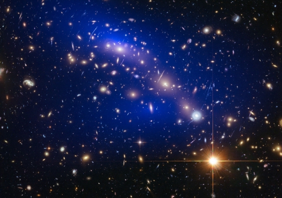 Blue in this image represents dark matter within the galaxy cluster MACS J0416.1–2403. Image: NASA