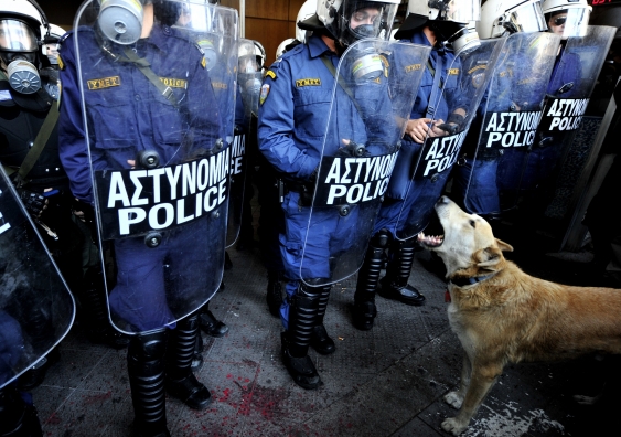 Loukanikos, which means sausage in Greek, barks in front of riot police in central Athens in 2010. Photo: Aris Messinis/AFP/Getty Images