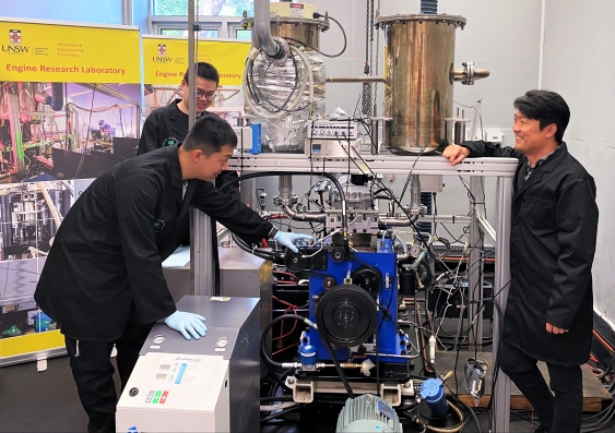 The Hydrogen-Diesel Direct Injection Dual-Fuel System has been developed by a team from the UNSW Engine Research Laboratory led by Professor Shawn Kook (right), and including Xinyu Liu (back left) and Jinxin Yang (front left). Photo from Prof. Shawn Kook