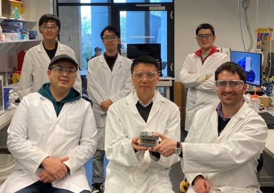 Using three novel methods, the research team were able to quickly figure out how stable a platinum-free fuel cell is. Photo: Front, from left to right: Shiyang Liu, Prof. Zhao, and Quentin Meyer. Back, from left to right: Dr Chen Jia, Shuhao Wang and Yan Nie.​ Supplied.