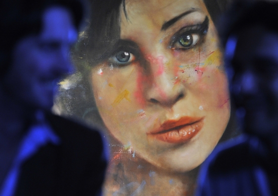 A painting ‘Amy’ by British artist Johan Andersson, hanging at a pub in central London. Toby Melville/Reuters
