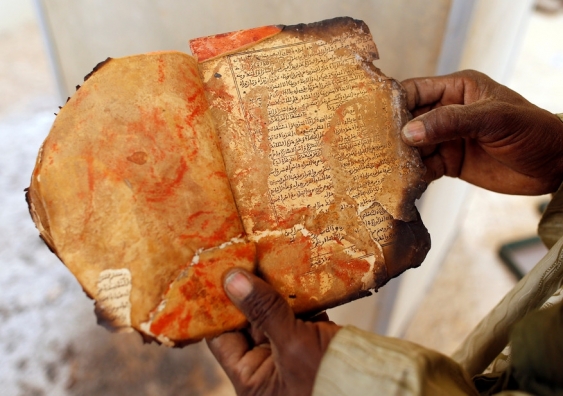 A burnt ancient manuscript at the Ahmed Baba Centre for Documentation and Research, in Timbuktu. Benoit Tessier/Reuters