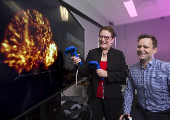 Professor Maria Kavallaris and Associate Professor John McGhee using virtual reality technology to explore human cells. Photo: Quentin Jones