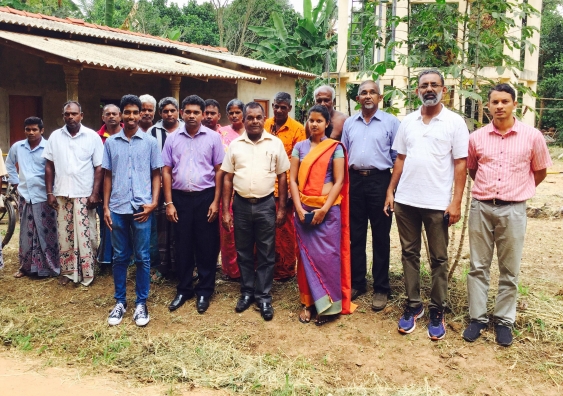 Buddhi Ranasinghe, a founding member of Impact Engineers, with villagers.