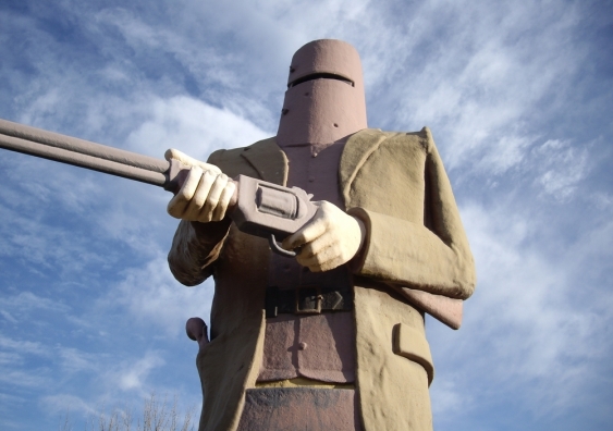 A statue of Ned Kelly in his famous armour, described by journalists at the scene as "made of ploughshares stolen from the farmers around Greta". Image from Shutterstock
