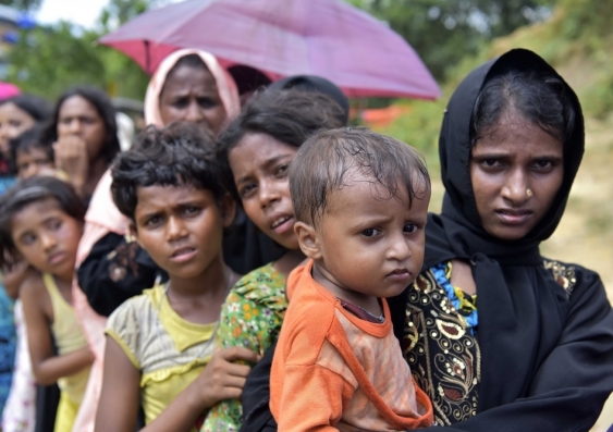 Myanmar's minority Rohingya people wait in a queue for a tram after crossing into Bangladesh. Image from Shutterstock
