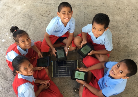 Students use the SolarSPELL technology. Photo courtesy of SolarSPELL