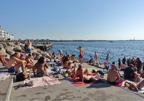 Crowds of people on the beach on the Oresund Strait in Malmö, Sweden, in August. Image: Shutterstock