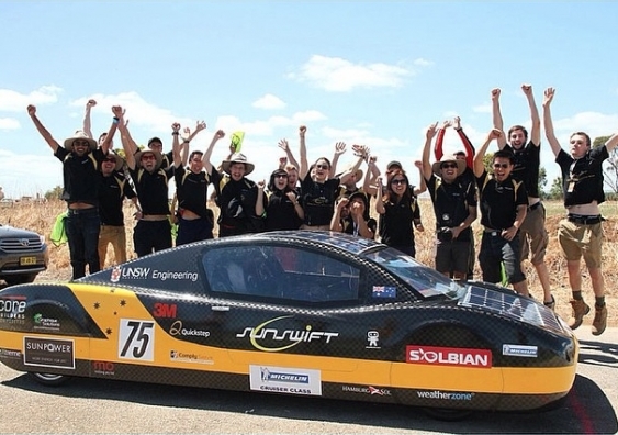 The team behind Sunswift eVe, the 5th generation car, in the field.