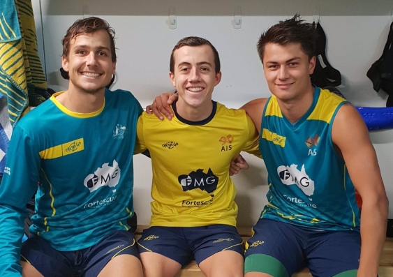 UNSW student Tim Brand (far right) made his senior international hockey debut for Australia at the weekend.