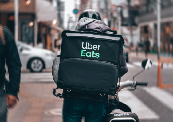 More investment in cycling infrastructure is needed to support app-based delivery services like Uber Eats. Photo: Unsplash.