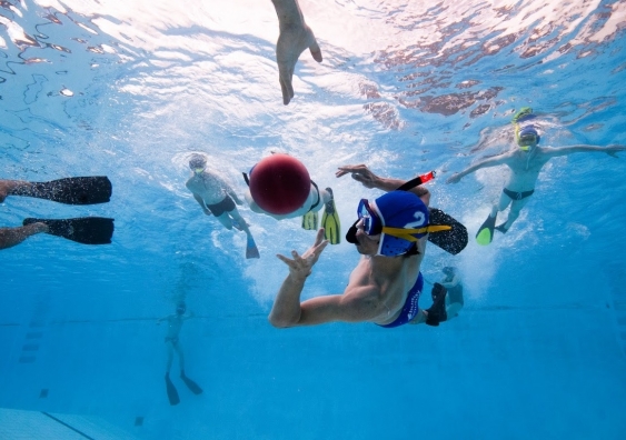 The underwater rugby ball is filled with saltwater causing it to sink slowly. Wilson Zhang