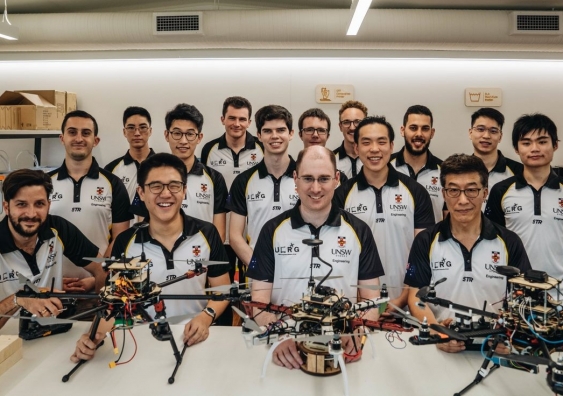 Dylan Sanusi-Goh (second from left) and Dr Mark Whitty (third from left) with the UNSW Engineering Competitive Robotics team