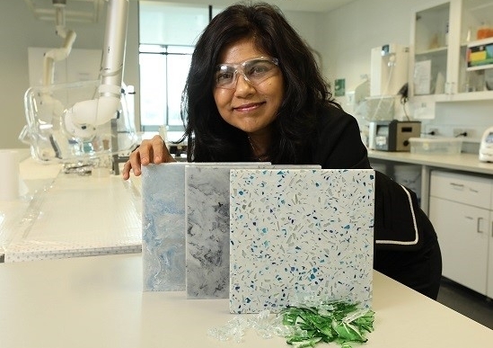 Professor Veena Sahajwalla, Director of UNSW’s Centre for Sustainable Materials Research and Technology (SMaRT), with glass waste ceramic tiles.
