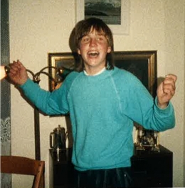 An adolescent Palli Thordarson holding his arms out and laughing