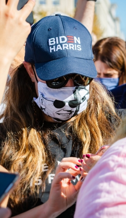 Woman wearing face mask with Joe Biden's face