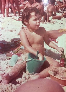 Mariana Mayer Pinto as a baby on the beach in Rio