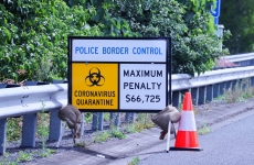 A sign at the border warning of fines for COVID-19 breaches