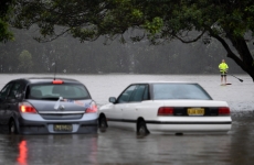 Two cars stranded in flood waters