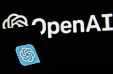 The Open AI logo on two devices