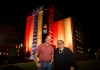 George Williams and Megan Davis with UNSW Library Building in the background lit with the Aboriginal flag and 'Yes'