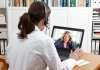 Female doctor consults with female patient online via laptop screen