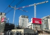 Two cranes shown in an area of Sydney where apartments are being constructed