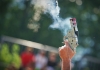 Smoke hovers around an athletic starter's gun that has just been fired