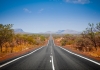 a highway extends away the horizon in the australian outback