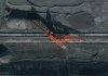 a large coal loader is seen from above amid piles of coal