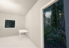 A room looking out onto a lush forest virtual landscape in The Edge of the Present  Photo - Alex Davies