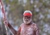 an elderly aboriginal man in ceremonial body paint