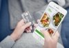 Close-up of woman holding phone ordering food on Uber Eats