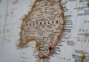 close up shot of australia on a world map with a pin on sydney