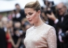 Amber Heard on the red carpet in a sparkly silver dress