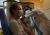 A doctor administering a vaccine to a patient