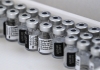 Multiple bottles containing mRNA vaccines