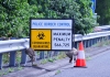 A sign at the border warning of fines for COVID-19 breaches