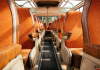 Inside an empty bus, with retro orange bus seats