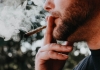 Man smoking cannabis marijuana in a joint