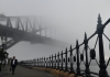 sydney harbour bridge surrounded by fog