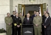 Prime Minister John Howard surrounded by cabinet members and senior military officers
