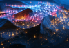 Colourful lights representing data points on a 3D mountainous terrain