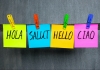 post-it notes experssing greetings in different languages