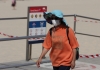 woman wearing a face mask at Bondi beach