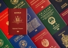 Red diplomatic passport of Australia against the background of different passports of the world