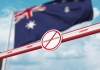 No immigration sign in front of Australian flag