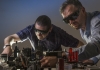two scientists working on optical beaming of electrical discharge
